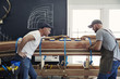 © Cavan Images - Carpenters working on canoe