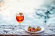 © rh2010 - Spritz Aperol drink with venetian traditional snacks cicchetti on the water chanal background in Venice. Traditioanal italian aperitif. Image with small depth of field