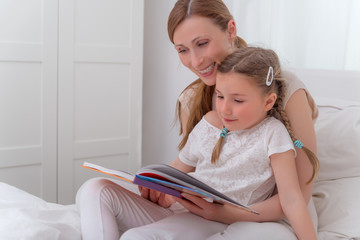 Sticker - mother reading to daughter