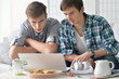 © aletia2011 - men watching video on laptop