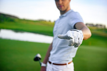Golfer Standing On Golf Course