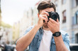 © Viacheslav Yakobchuk - Pleasant cheerful man holding photo camera