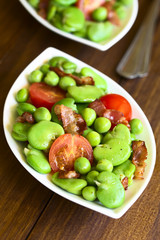 Wall Mural - Broad bean, green pea, cherry tomato and fried bacon salad, photographed on dark wood with natural light (Selective Focus, Focus one third into the image)