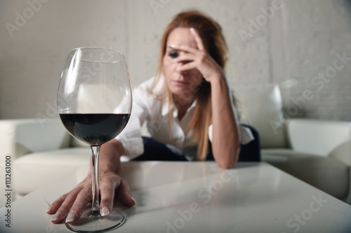 Fotomural sad depressed alcoholic drunk woman drinking at home in housewife alcohol abuse