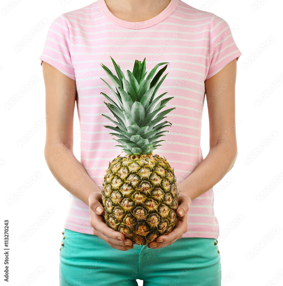 Woman holding pineapple on white background