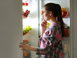 © Africa Studio - Young beautiful woman looking into fridge at night