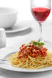italian spaghetti bolognese topped with cheese and basil