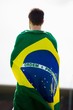 © WavebreakMediaMicro - Athlete with brazilian flag wrapped around his body