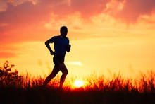 Athletic Runner At The Sunset
