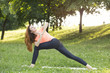 © rilueda - Beautiful woman doing yoga outdoors