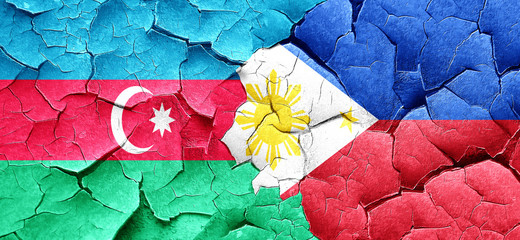 Azerbaijan flag with Philippines flag on a grunge cracked wall