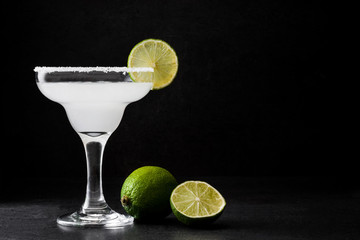 Wall Mural - Margarita cocktail on slate background

