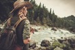 © Nejron Photo - Beautiful woman hiker enjoying amazing landscapes near wild mountain river.