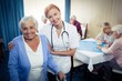 © WavebreakMediaMicro - Portrait of a nurse assisting a senior using a walker