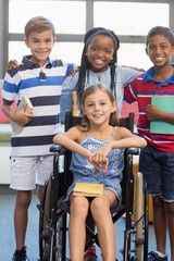 Sticker - Smiling school kids standing with arm around in library