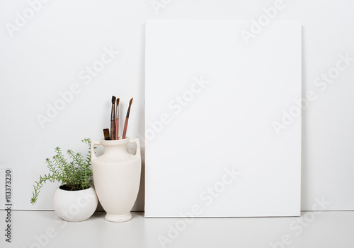 Fotografía Empty blank canvas on a white background, home interior decor
