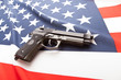 Ruffled national flag with hand gun over it series - United States