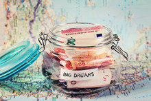 Piggy Bank Woth Words Big Dreams On Travel Map. Saving Money For Travel. Dreaming Concept