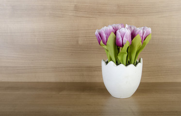 Wall Mural - Tulip flowers against wooden background