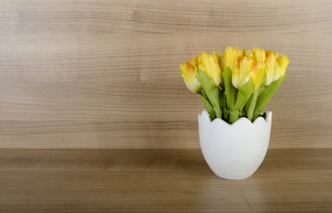 Wall Mural - Tulip flowers against wooden background