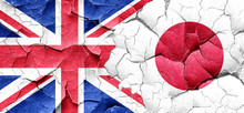 Great Britain Flag With Japan Flag On A Grunge Cracked Wall