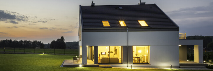 Illuminated house at dusk