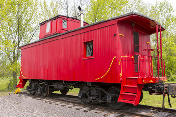 Red Wooden Railroad Caboose On Train Track