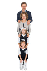 Wall Mural - Happy family of four father, mother, and two daughters, are vertical to each other - Isolated on white background