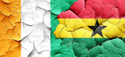 Ivory coast flag with Ghana flag on a grunge cracked wall