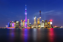 Scenic View Of River And Illuminated Cityscape Against Sky