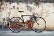 City bicycle fixed gear and cracked concrete old wall background