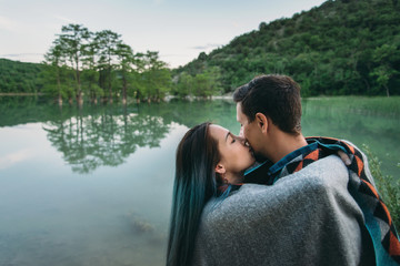 Wall Mural - Couple resting on lake