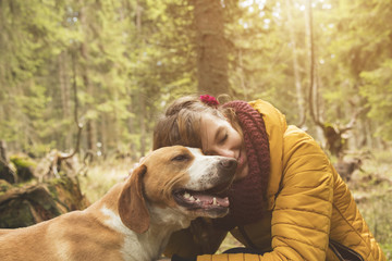 Woman with her beautiful dog in nature.

