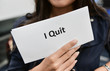 © magneticmcc - I Quit - Business woman is showing the document for resignation for quit the job