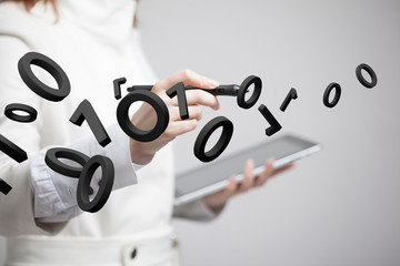 Woman working with binary code, concept of digital technology.
