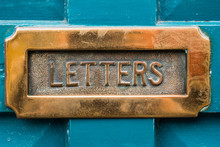 Vintage Brass Letterbox On Blue Door Background