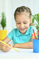 Wall Mural - little girl drawing at home
