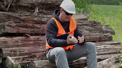 Poster - Worker comparing the terms of reference