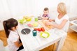 © Spectral-Design - A mother and her children having breakfast at home..