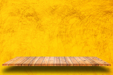 Poster - Empty wooden shelves and yellow cement wall background.