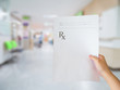 © Kwangmoozaa - hand hold medical prescription at the hospital