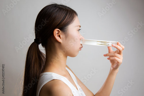 洗濯バサミで鼻を挟む女性 Buy This Stock Photo And Explore Similar Images At Adobe Stock Adobe Stock