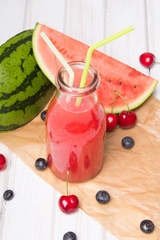 Wall Mural - Fresh watermelon juice on a wooden background