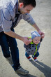 © Nelli Kovalchuk - Father helping his son for the first steps