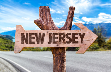 Wall Mural - New Jersey wooden sign with road background