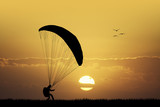paraglider at sunset