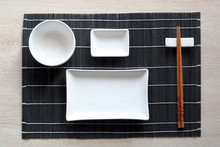 Japanese Table Setting With Traditional Mat And Sushi Kit. Top View