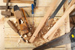 Carpenter tools on wood table background. Top view. Copy space