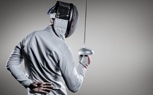 Composite Image Of Man Wearing Fencing Suit Practicing With Sword