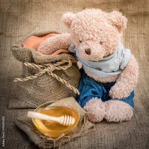 Obraz Dibond cup honey on sackcloth Vintage Style and selective focus